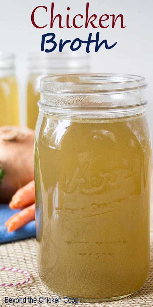Chicken broth in a glass canning jar.