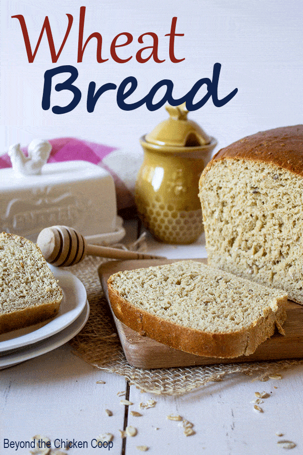 Delicious Homemade Wheat Bread made with white wheat flour. This bread is perfect for sandwiches or toasted with butter and honey. #baking #bread #wholewheatbread