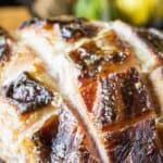 A large baked ham with a scored top and crust.