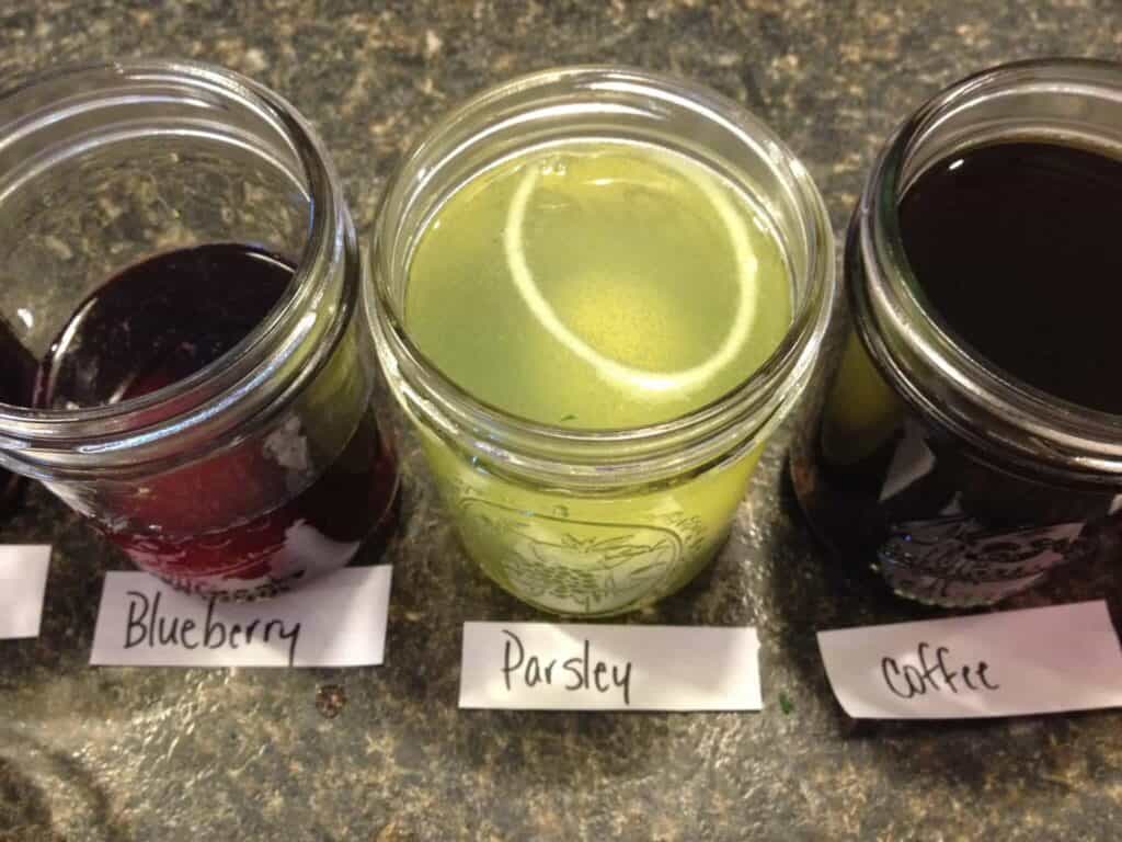 Jars of colored water for coloring eggs.