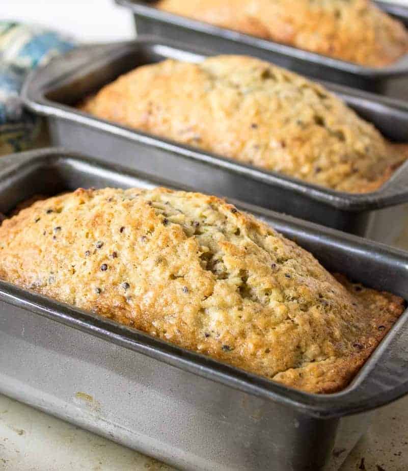 Homemade bread cooling in pans.