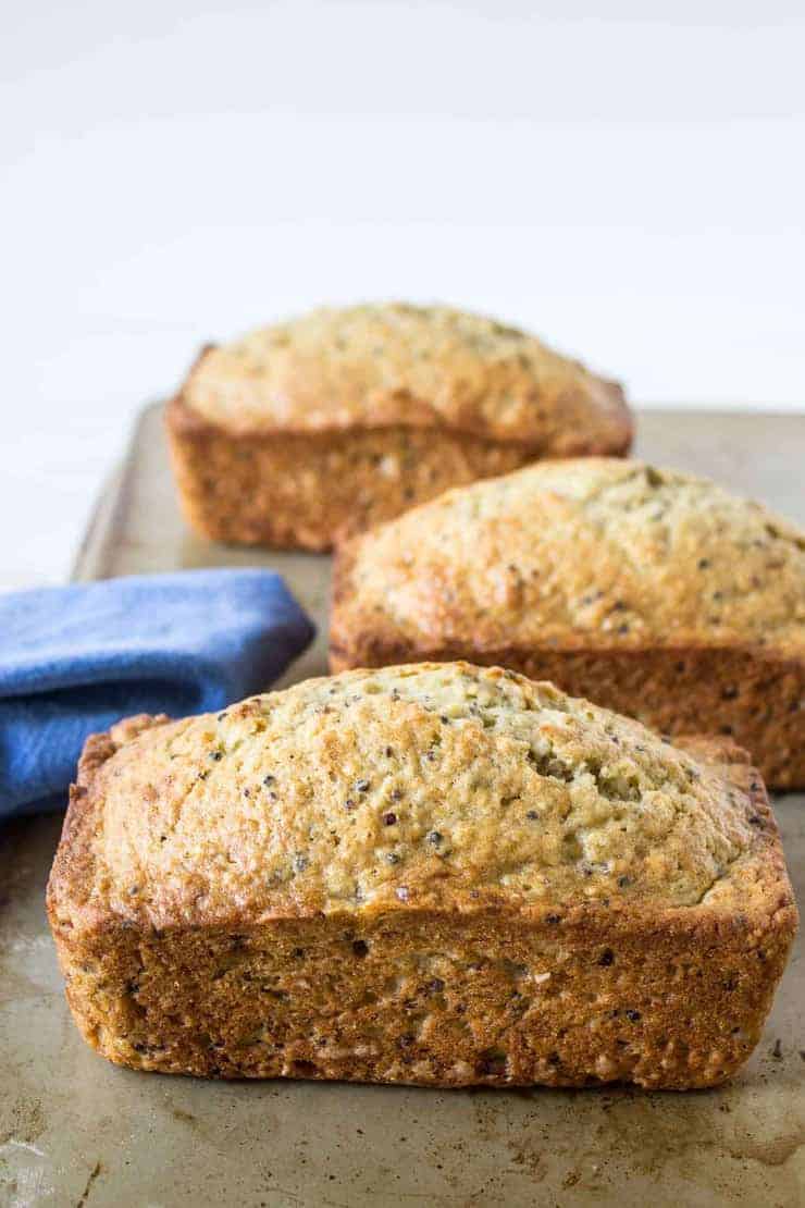 Loaves of banana bread on a baking sheet.