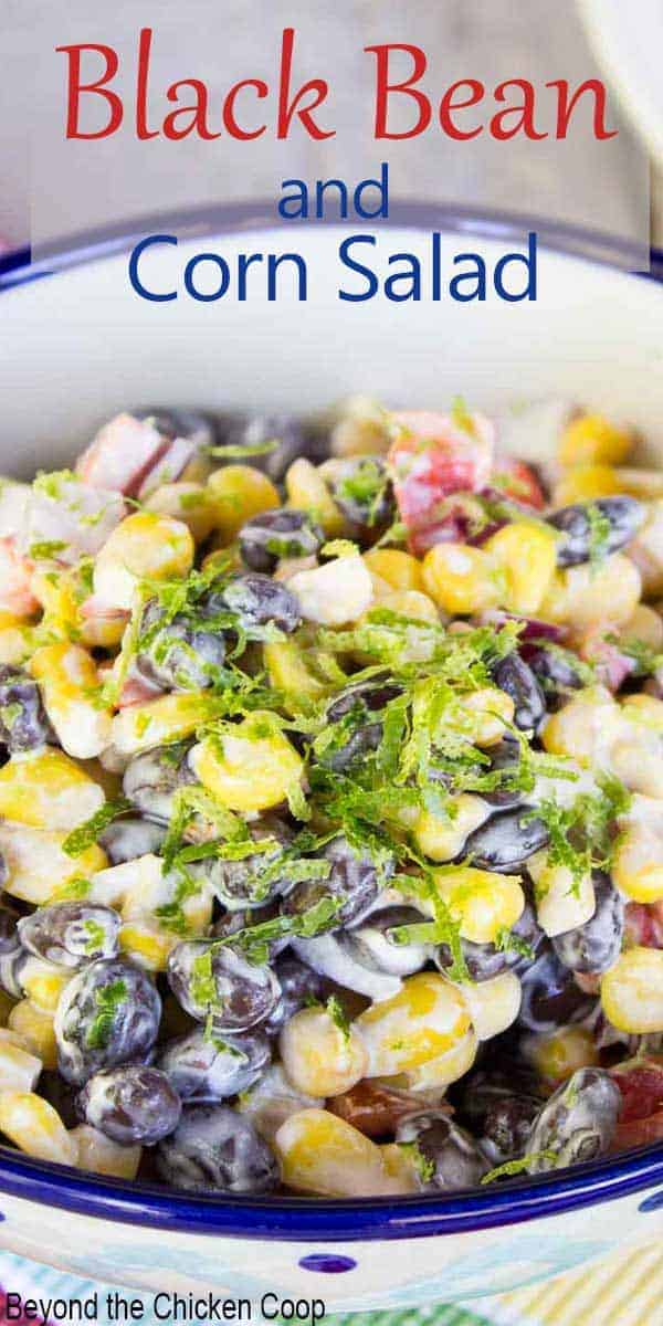 A bowl filled with black beans and corn with lime zest.