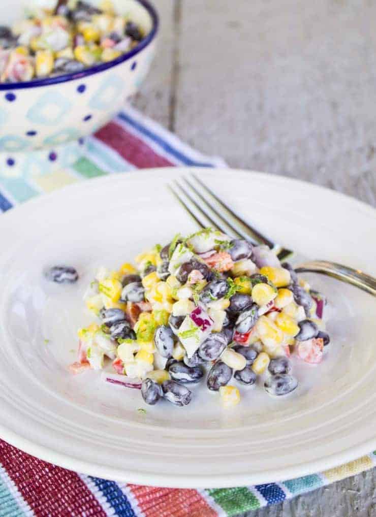 Black Bean and Corn Salad with a Jalapeno Lime Dressing on a white plate.