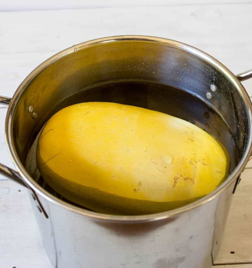 Spaghetti Squash in a pot full of water.