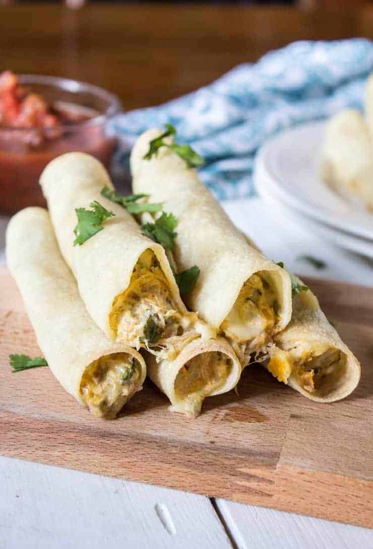 Baked Chicken Taquitos with a creamy chicken filling.