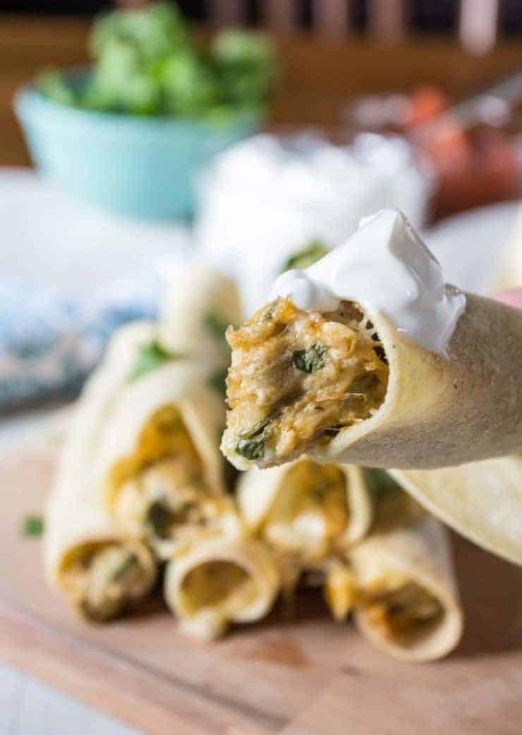 Baked Chicken Taquitos with a dollop of sour cream.