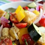Fresh tomatoes, cucumbers, peppers and onions all mixed together in a big salad.
