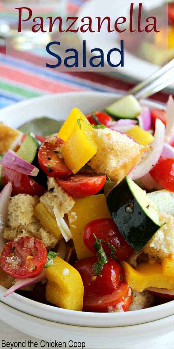 Fresh tomatoes, cucumbers, peppers and onions all mixed together in a big salad. 