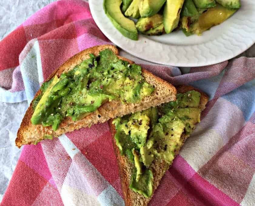 Grilled Avocados on Toast with a sprinkle of sea salt and crushed black pepper. 