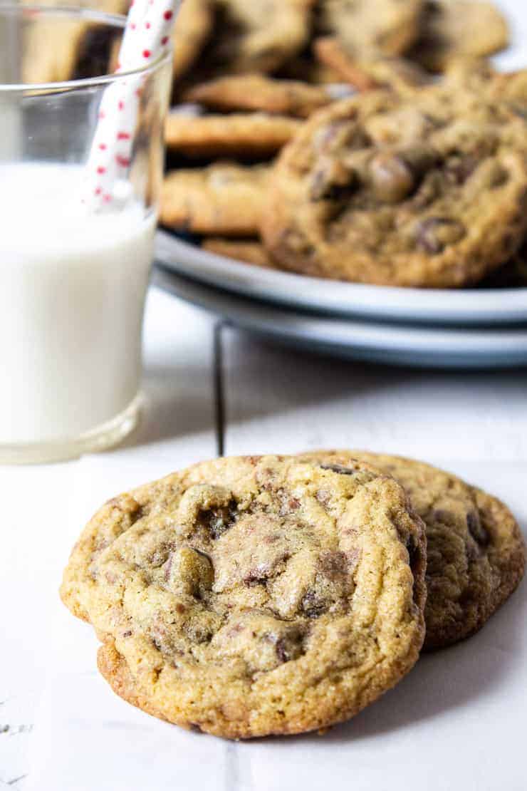 Toffee Chocolate Chip Cookies with a glass of milk.