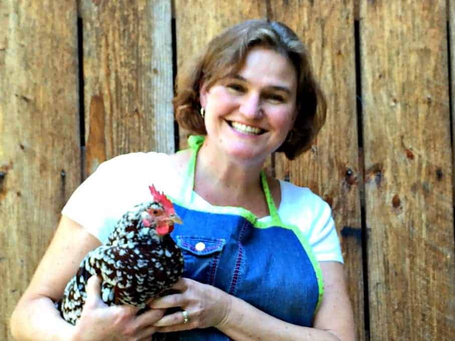 Kathy holding a chicken.