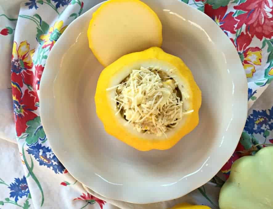 Stuffed squash in a white baking dish. 