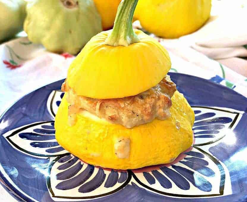 Stuffed Pattypan with stuffing spilling down the side of the squash.