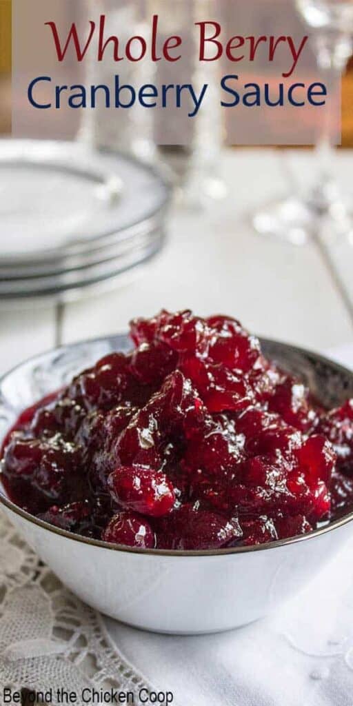 A china bowl filled with cranberry sauce.