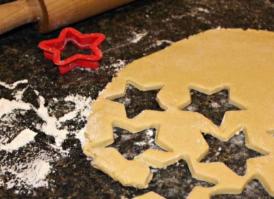 Cookie dough cut into star shapes.