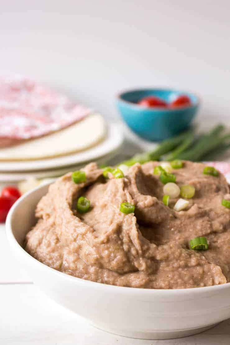 Large bowl of mashed pinto beans.