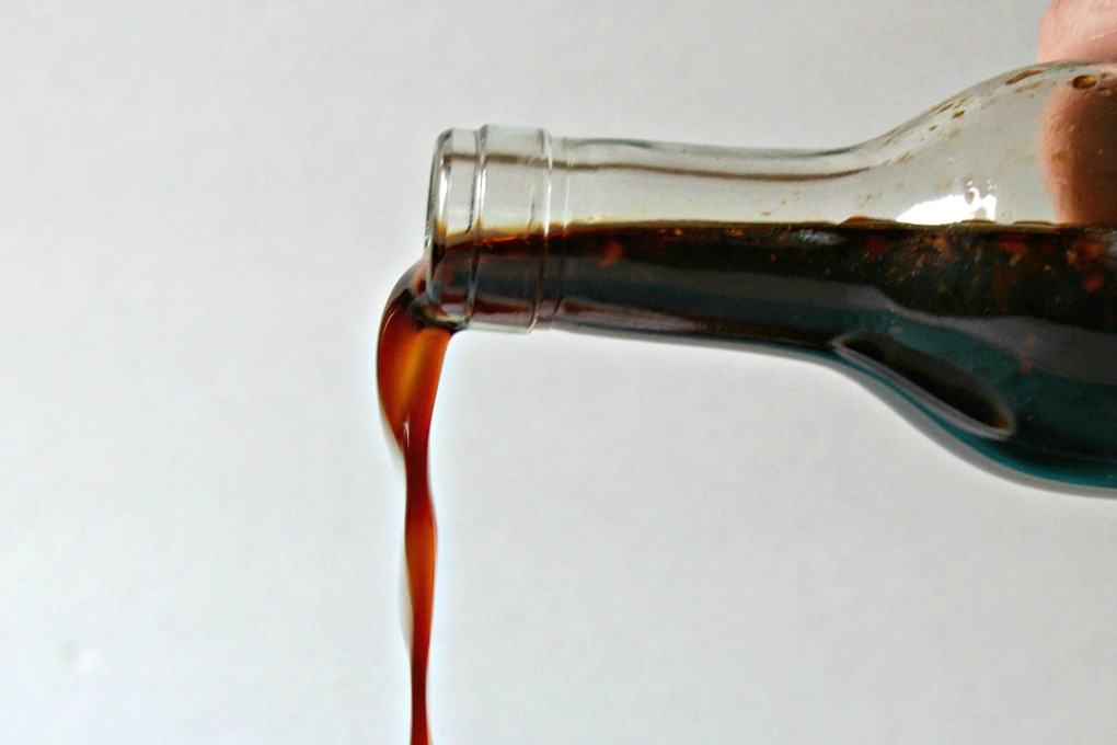 Homemade Teriyaki Sauce pouring from a bottle