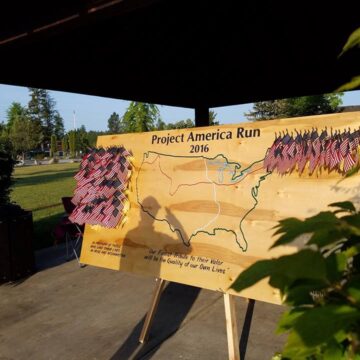 A wooden map on a stand.