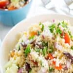 Mediterranean Couscous Salad is filled with fresh chopped tomatoes, bell peppers, olives and fresh herbs. This vegetarian salad is perfect for potlucks or barbecues. #couscous