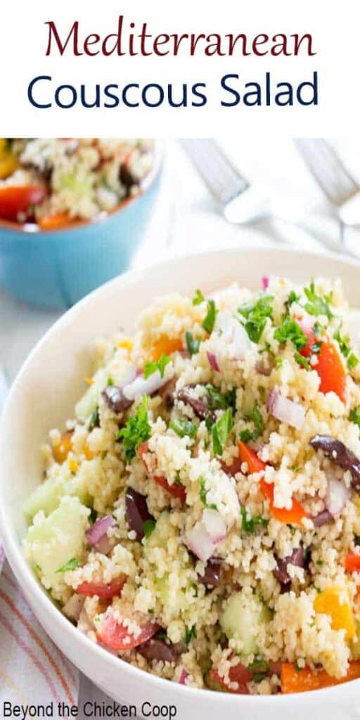Mediterranean Couscous Salad is filled with fresh chopped tomatoes, bell peppers, olives and fresh herbs. This vegetarian salad is perfect for potlucks or barbecues. #couscous