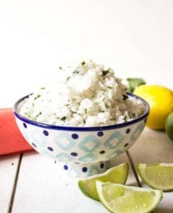 A blue and white patterned bowl filled with rice.