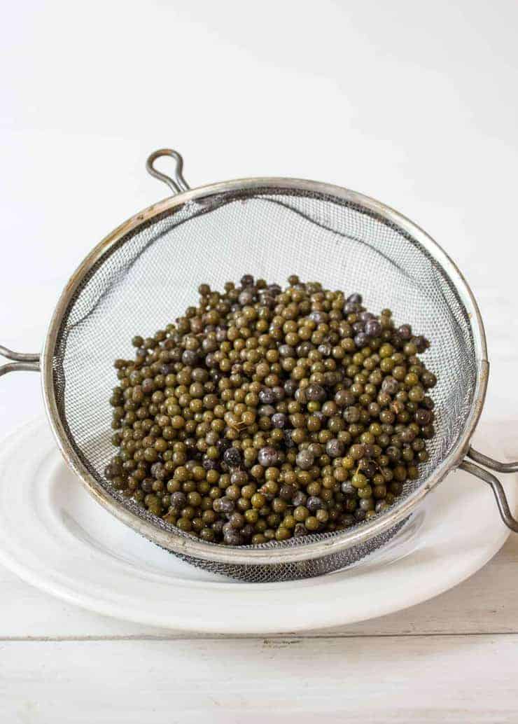 Elderberries strained after being soaked in vodka.