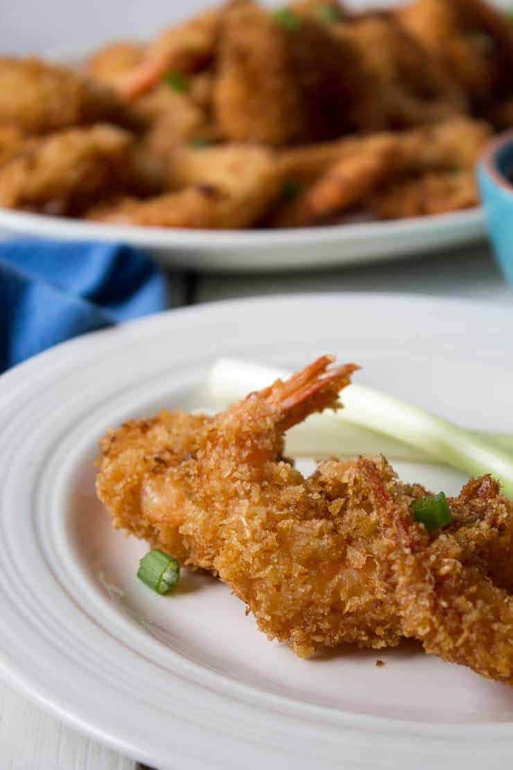 Shrimps served on a small white plate.