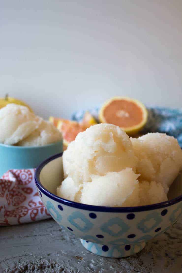 Scoops of Grapefruit Sorbet in a blue patterned bowl.