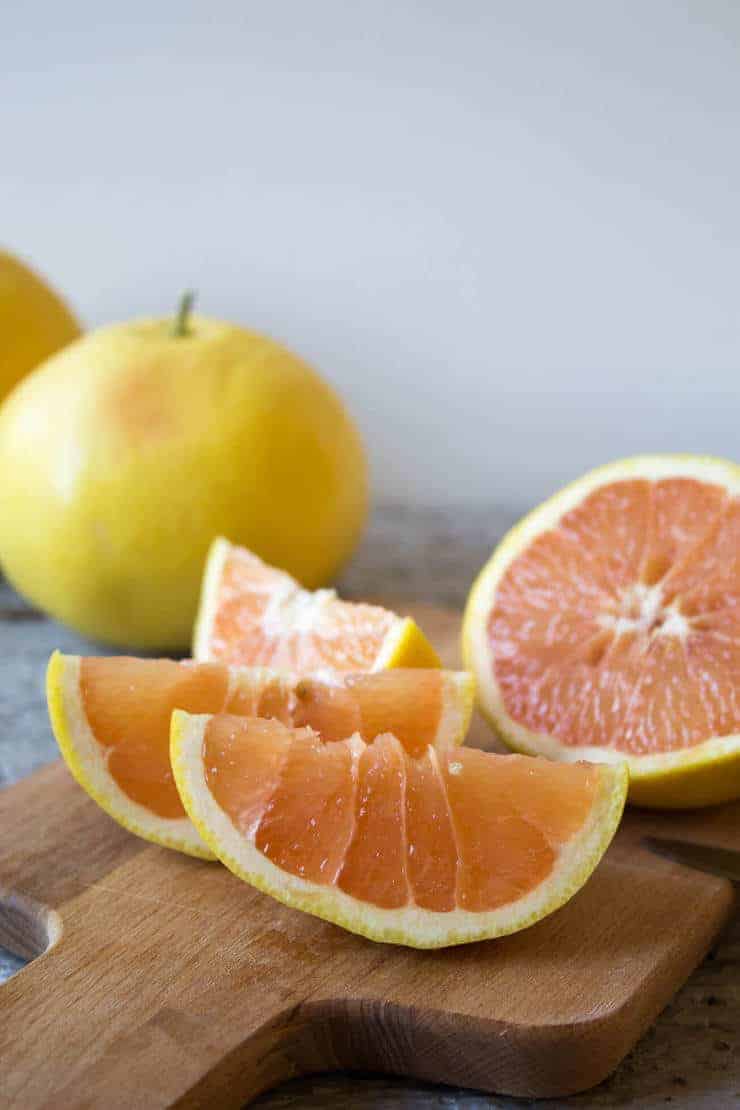 Ruby red grapefruits sliced into wedges.