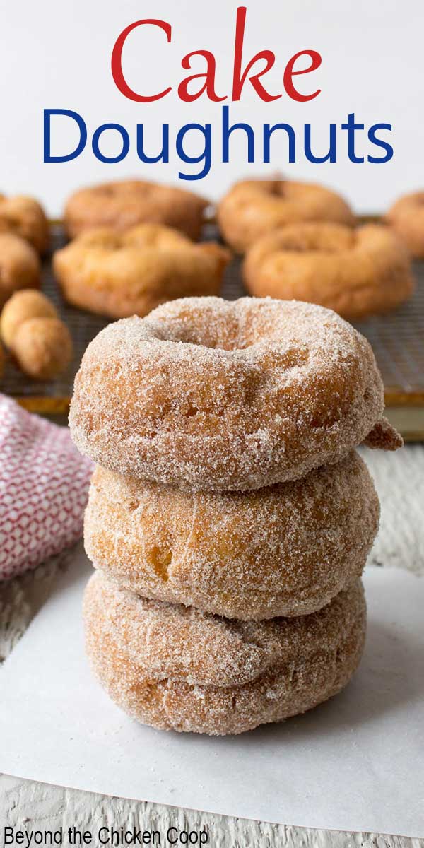 Three doughnuts stacked on top of each other.