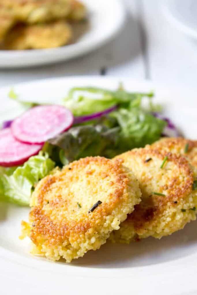 Crispy couscous cakes served on a plate. 
