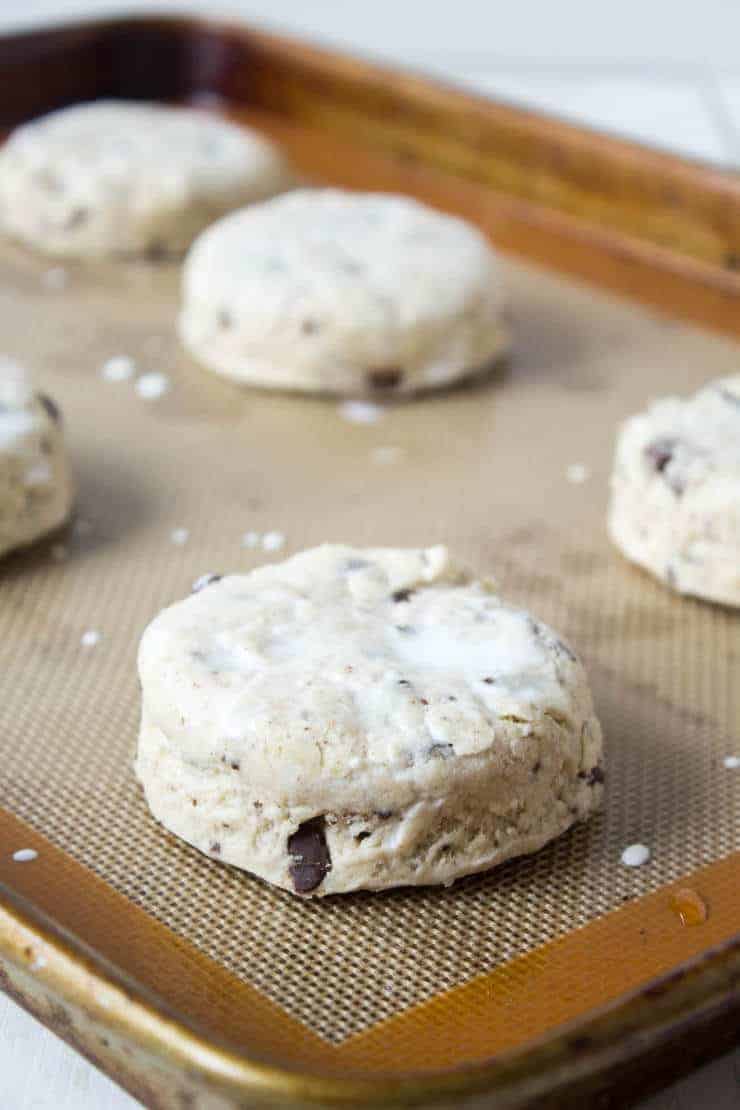 Biscuit dough filled with chunks of chocolate and topped with fresh cream.