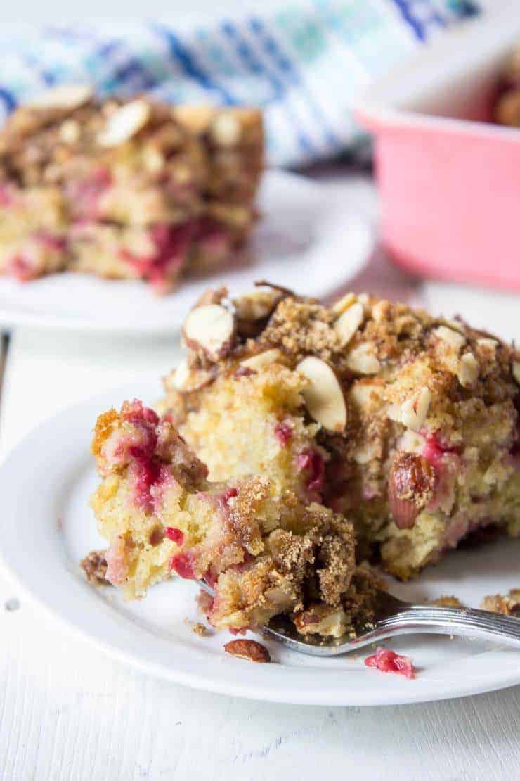 A slice of Raspberry Almond Coffee Cake on a small white plate.