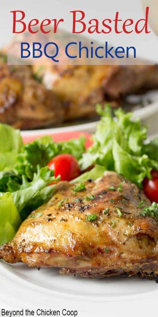 Crispy chicken thigh on a plate with a green salad.