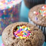 Pinata cupcakes filled with colored sprinkles.