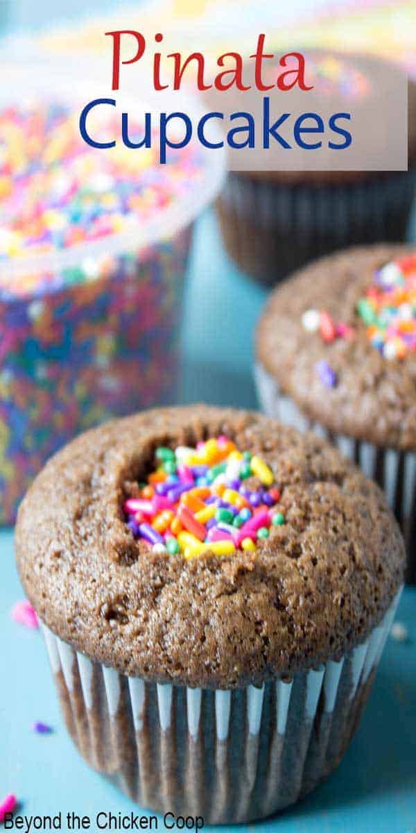 Pinata cupcakes filled with colored sprinkles.