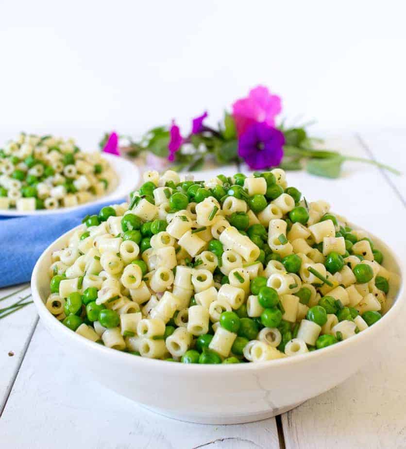 Pasta salad in a large white bowl.