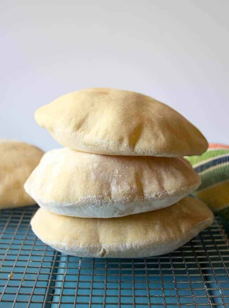 Homemade Pita Bread stacked three pitas high. 