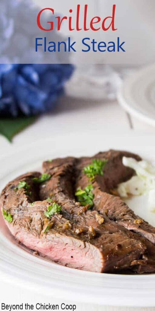 Slices of cooked flank steak on a white plate.