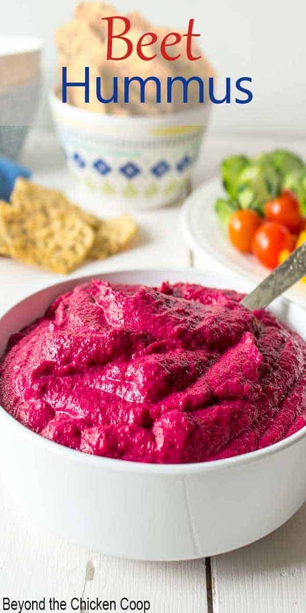 A bowlful of bright pink beet hummus.