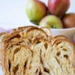 A slice of bread filled with apples and cinnamon.