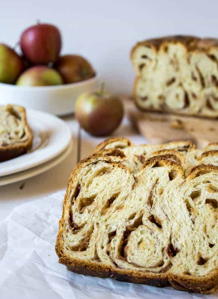 Slices of bread overlapping each other on parchment paper.