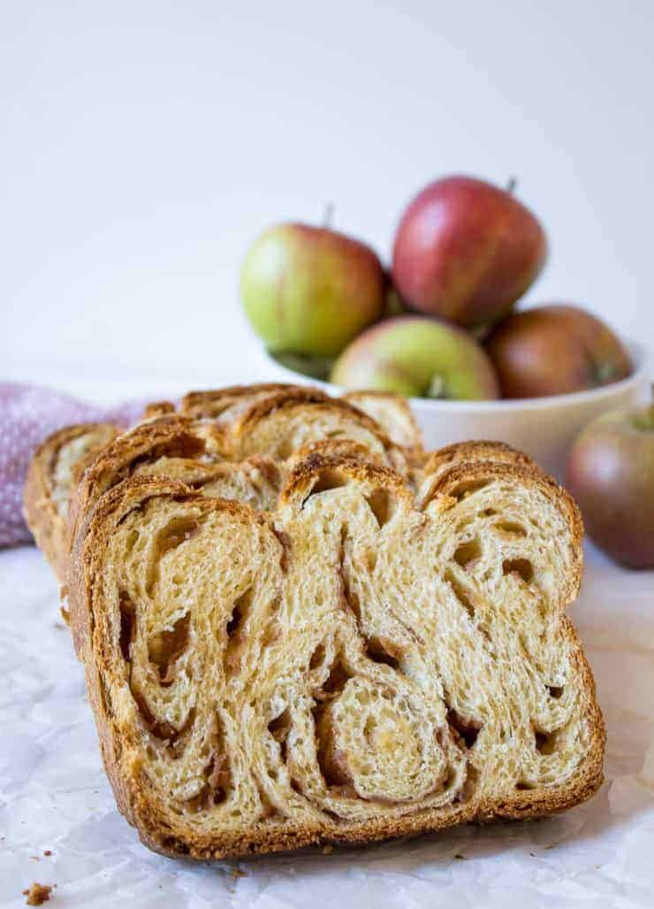 Slices of bread filled with swirled apples and cinnamon.