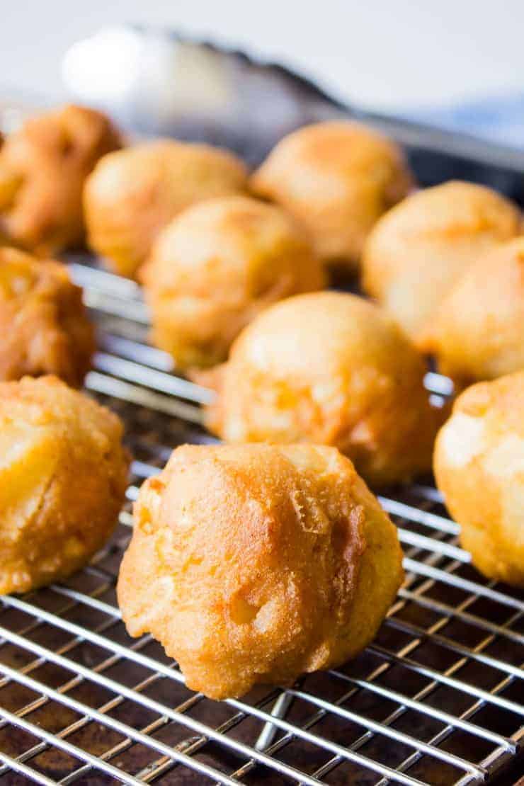 Fried dough sitting on a cooling rack.