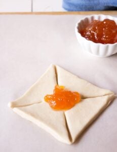 Making apricot jam pinwheels.