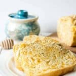 A delicious slice of beer bread with cheddar cheese.