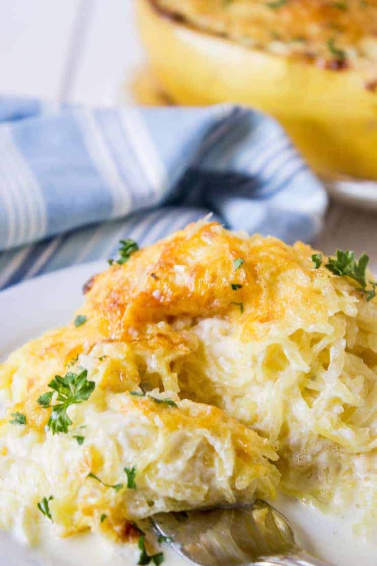 Spaghetti Squash Alfredo topped with golden browned cheese.