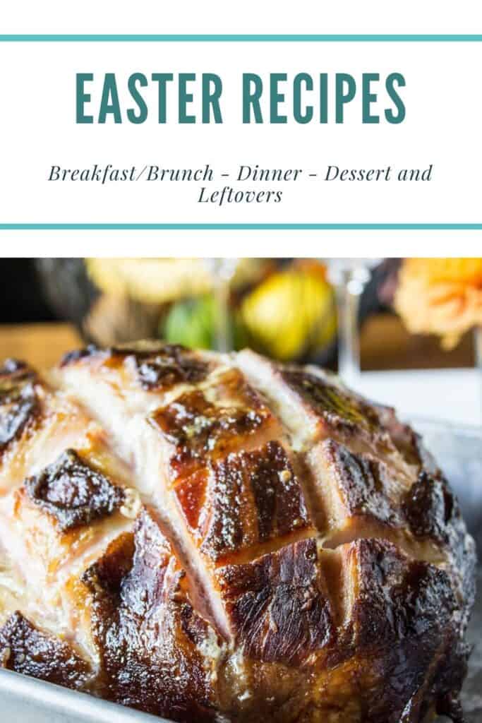 A baked ham in a metal baking dish.