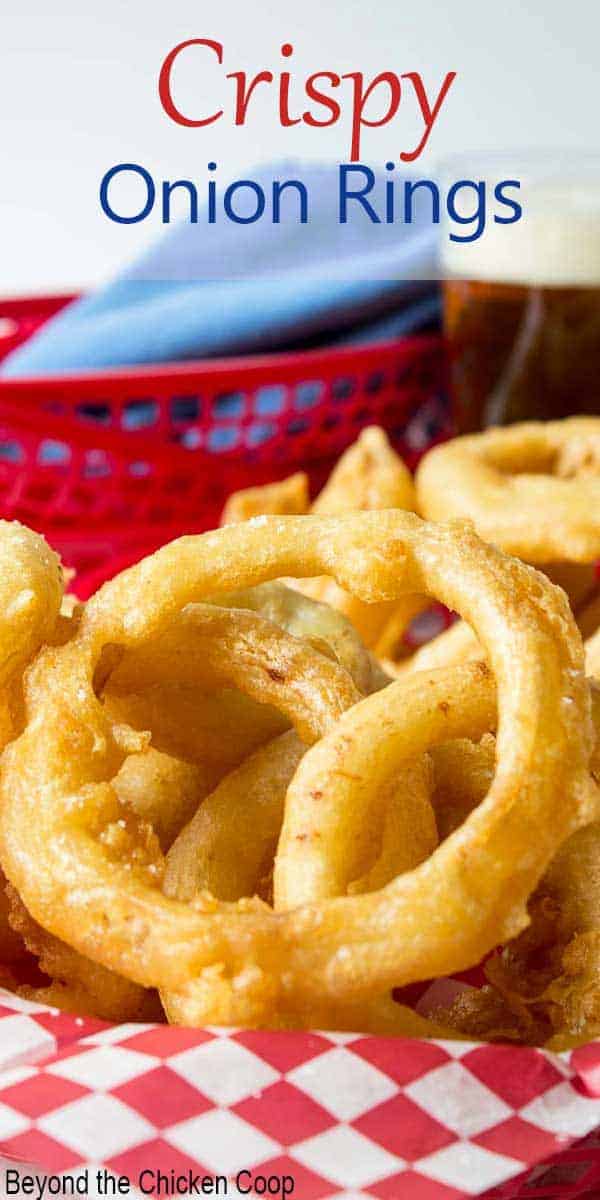 A red basket filled with fried onions.